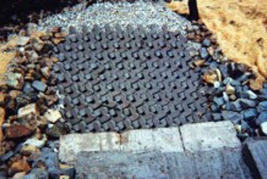 Ajacks concrete armor units protecting a channel drop. 