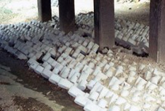 ArmorFlex cellular concrete blocks protecting a bridge from erosion and scour. 