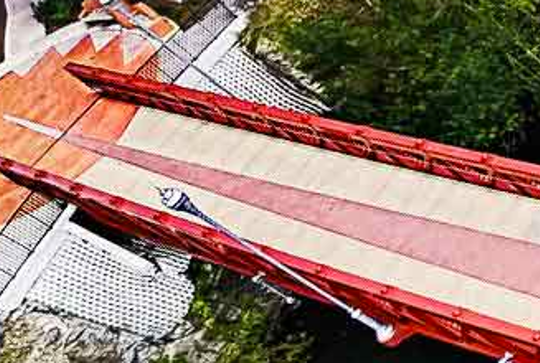 A Continental pedestrian bridge over as river.