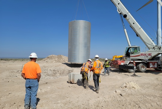 Installation of corrugated metal pipe. 