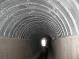 Inside view of corrugated metal pipe. 