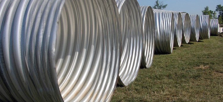 row of corrigated metal pipe.